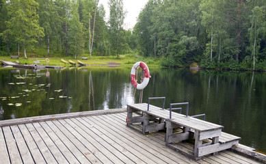 The mooring on the forest lake. Finland