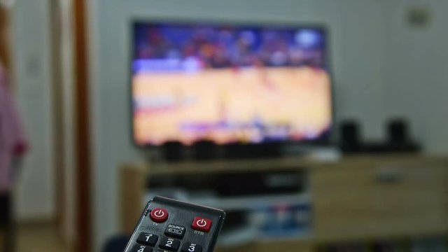 Remote control with flat screen tv on the background