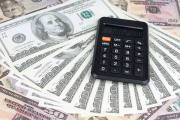 calculator green notebook with dollar bills on the background of money borrowed money concept