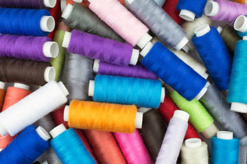 texture multicolored thread on reels selective focus