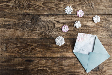 white envelope with flowers on white background.