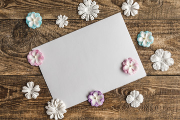 white envelope with flowers on white background.