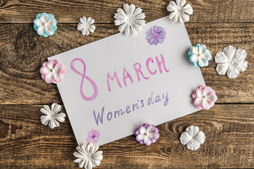 white envelope with flowers on white background.