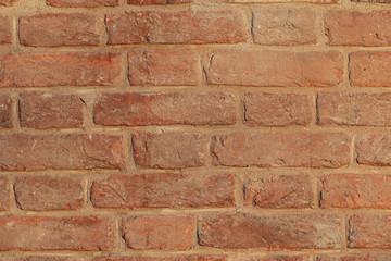 red brick wall texture grunge background with vignetted corners, may use to interior design