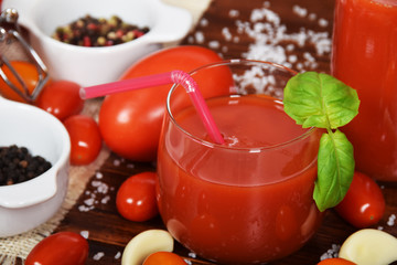 spicy fresh tomato juice with colored pepper and basil with free space for text