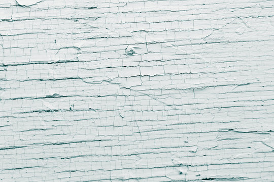 Texture by some parched painted deck-plank