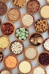 Macrobiotic health food with dried pulses, vegetables, cereals, whole wheat pasta, seeds and nuts with foods high in protein, omega 3, anthocyanins, antioxidants, minerals and vitamins.