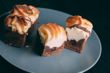 curd cake in a plate lies on a wooden background