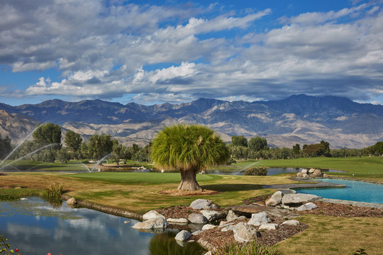 Scenic view of landscape against blue cloudy sky