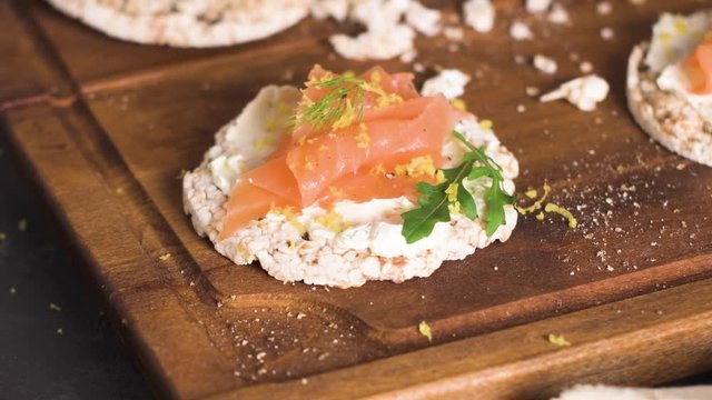 Delicious smoked salmon and cream cheese on rice bread toasts.