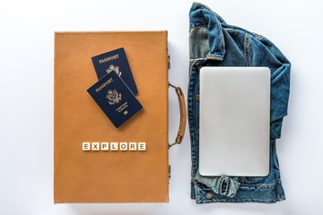 Vintage Suitcase with Passports, Denim Jacket, Laptop Computer