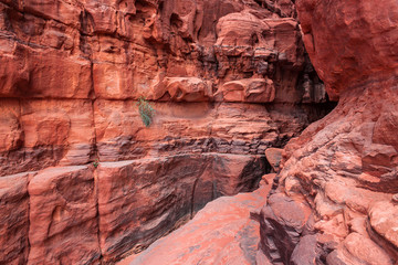 Red stone walls of the canyon of Wadi Rum desert in Jordan. Wadi Rum also known as The Valley of the Moon is a valley cut into the sandstone and granite rock in southern Jordan to the east of Aqaba.