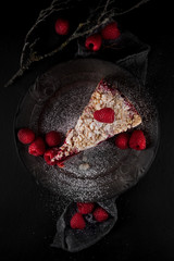tasty juicy raspberry tart with raspberries, rustic studio shot, can be used as background 