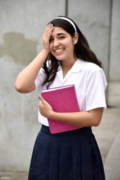 Happy Catholic Colombian Girl Student Wearing School Uniform With Notebook
