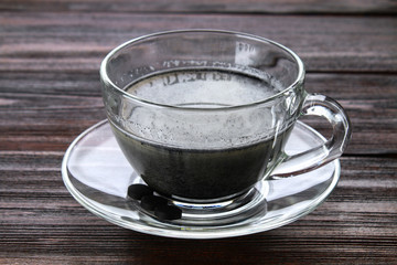Coal latte. Black cappuccino. Black coffee with activated carbon.