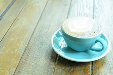 Close up of a Blue coffee cups on wooden table backgrounds