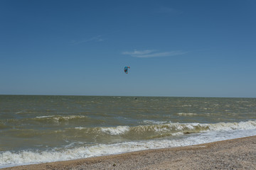 Man Kite Surfing Near Beach