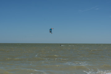 Man Kite Surfing Near Beach