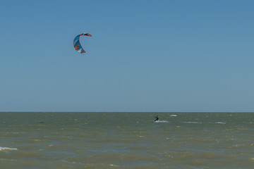 Man Kite Surfing Near Beach