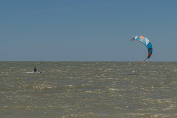 Man Kite Surfing Near Beach