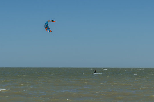 Man Kite Surfing Near Beach