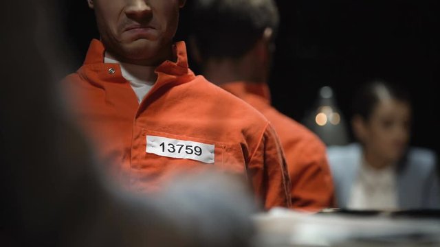 Prosecutor lady and convicted criminal during interrogation questioning prison