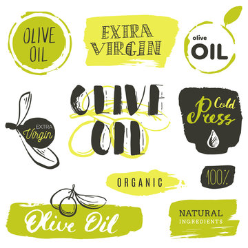 Vector hand lettering olive production logos or signs. Retro sketched extra virgin oil illustrations set for farm or cosmetics produce, packaging badges, tags, cafe, stores design etc.