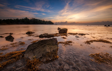 Sunrise seascape at Kudat, Sabah Malaysia. Image contain soft focus and blur due to long expose.