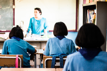 Students are studying in the elementary school classroom.