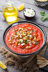 Chickpea soup. Moroccan dish. Wooden background.