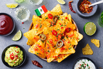 Nachos chips with Mexican flag and dips variety