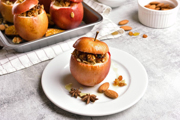 Baked apples with granola, cinnamon, nuts and honey