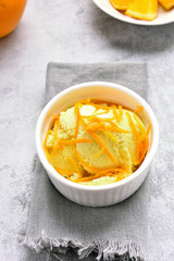 Orange ice cream in bowl