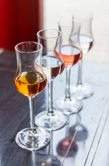 Different alcohol types in glasses on table