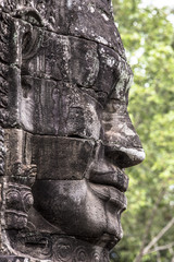 Fototapeta na wymiar Bayon temple smiling buddha face Angkor Wat Siem Reap Cambodia South East Asia travel