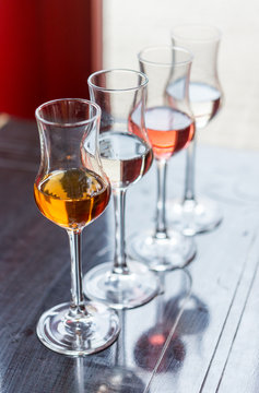 Different alcohol types in glasses on table