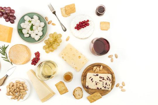 Various types of cheese with wine on a white background © laplateresca