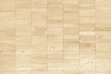 Tuinposter Steen Rock stone tile wall texture rough patterned background in beige creme brown color