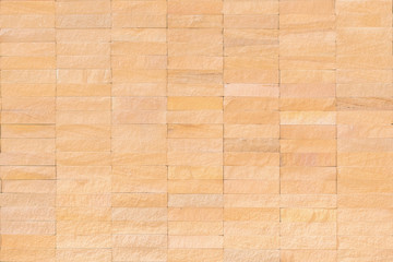 Rock tile wall texture background in natural cream brown beige