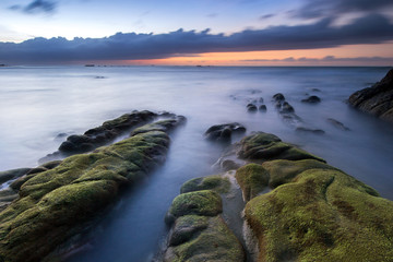 long clouds above the sea during sunset at Kudat, Sabah Malaysia. image contain soft focus and blur due to long expose.