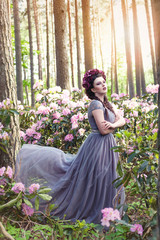 girl in dress in rhododendron garden