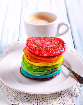 Rainbow pancakes, served in pile