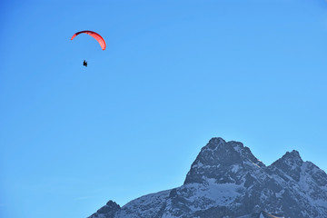 Fototapeta na wymiar Paragliding in the Allgaeu Alps near Oberstdorf. Bavaria, Germany