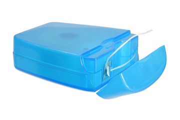 Dental floss in container isolated on white