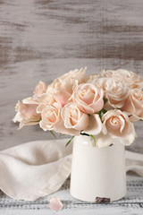 Pink roses in vintage vase