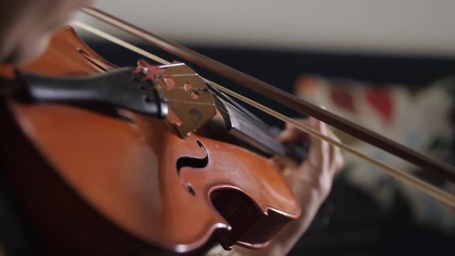 Playing the violin close up.