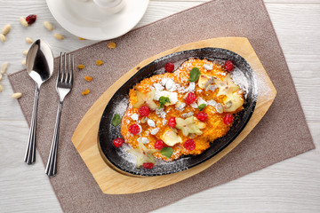 pumpkin porridge on white wooden background