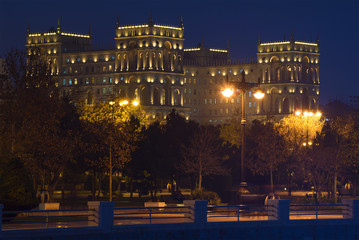Fototapeta na wymiar The palace of the government of Azerbaijan in a night landscape. View from side of the Seaside park. Baku