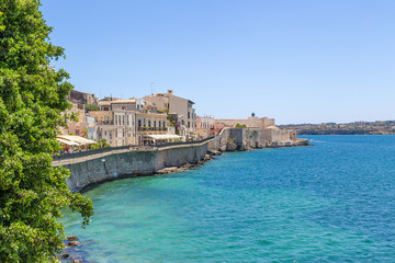 Syracuse, Italy. The embankment of the island of Ortigia with the ancient fortifications - obrazy, fototapety, plakaty