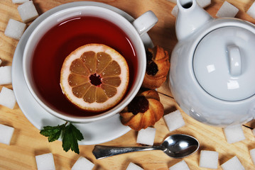 homemade marmalade cookies and sweet forest fruit tea with lemon for the afternoon with mum